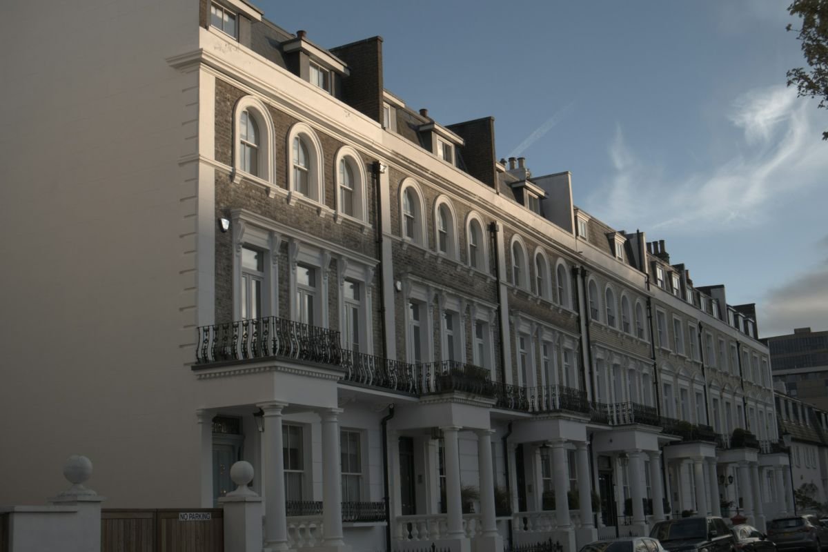 Stucco-fronted London terrace under a grey sky
